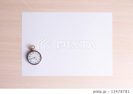 classic clock on a white sheet of paper 13478781