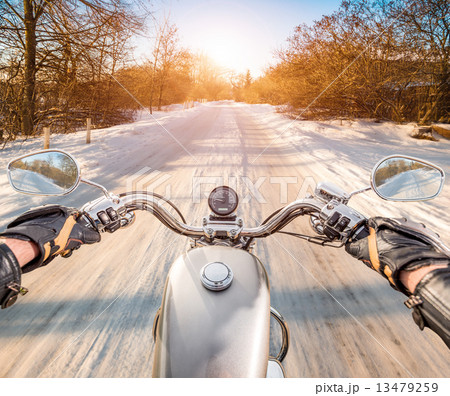 Biker First-person view. Winter slippery road 13479259