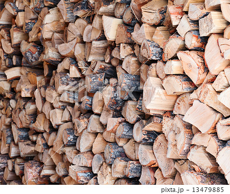 Woodpile from dry oak logs. Woodpile from dry oak logs. 13479885