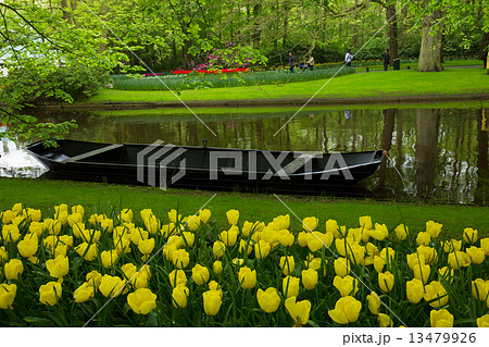 spring garden with canal and boat spring garden with canal and boat 13479926