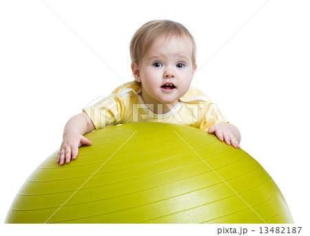 child girl doing fitness exercise with fitness ball 13482187