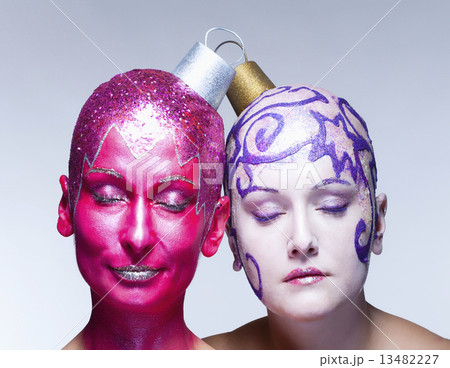 Two women posing as Christmas ornaments Two women posing as Christmas ornaments 13482227