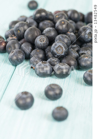 Blueberries - Delicious juicy blueberries on a blue wooden table 13482549