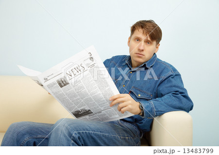 Man disappointed with news from newspaper 13483799