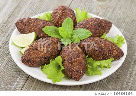 Kibbeh - Middle Eastern minced meat and bulghur fried snack Kibbeh - Middle Eastern minced meat and bulghur fried snack 13484134