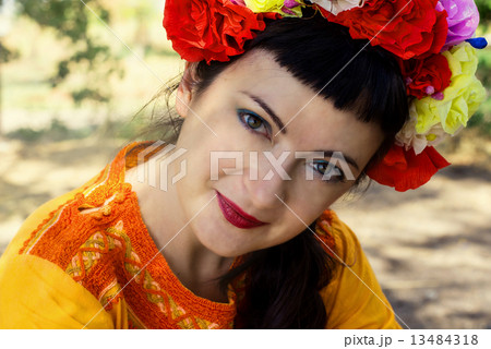 woman in wreath of roses on her head woman in wreath of roses on her head 13484318
