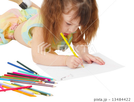 Child draws a picture with colored pencils Child draws a picture with colored pencils 13484422