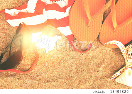 orange sandals and shells 13492326