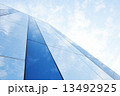 Glass building against the sky 13492925
