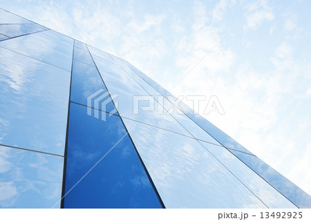 Glass building against the sky 13492925