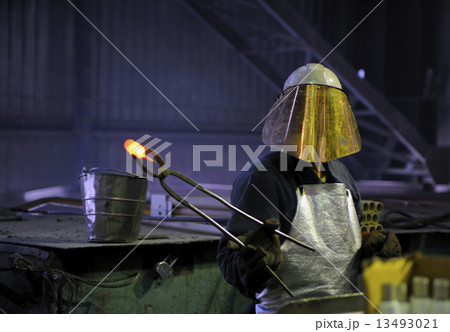 worker with hot steel 13493021