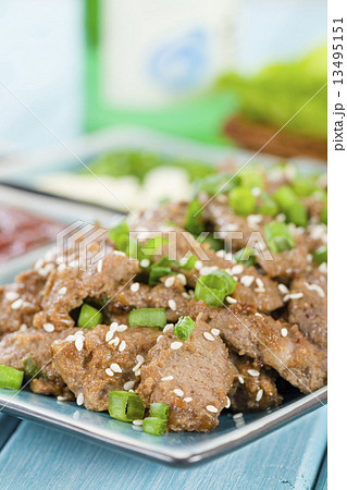 Bulgogi - Korean grilled marinated beef served with green chillies, garlic and kimchi . 13495151