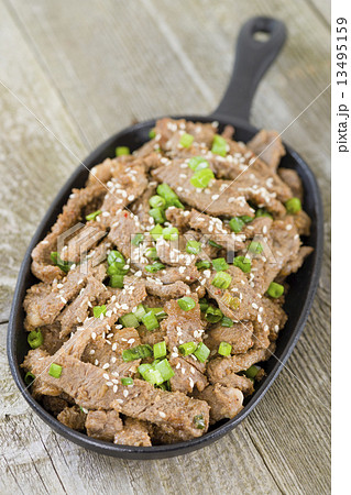 Bulgogi - Korean grilled marinated beef in a sizzle pan. Bulgogi - Korean grilled marinated beef in a sizzle pan. 13495159