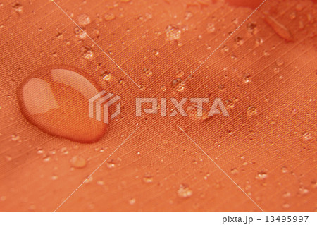 Orange waterproof coating background with water drops 13495997
