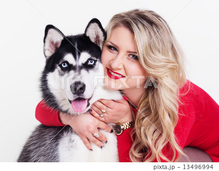 Young girl with her husky dog isolated on white 13496994