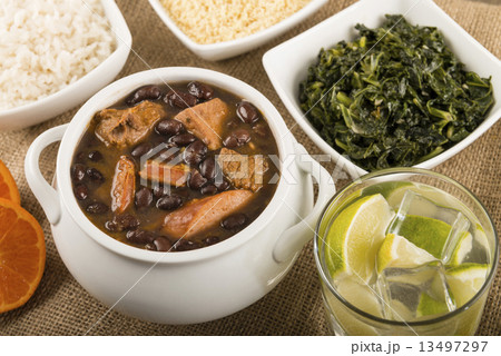 Feijoada - Brazilian meat & bean stew, side dishes & caipirinha  13497297