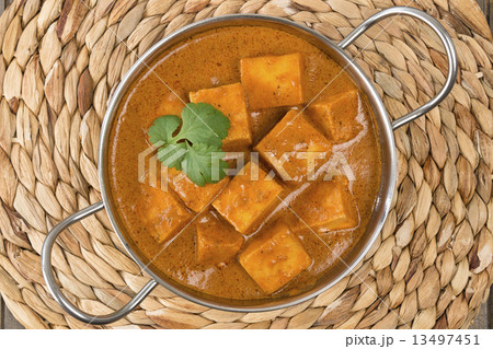 Paneer Butter Masala - Indian curd cheese curry in a balti dish.  13497451