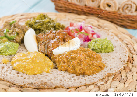 Ethiopian Feast - Injera (sourdough flatbread) with stews Ethiopian Feast - Injera (sourdough flatbread) with stews 13497472