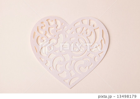 carving heart cutted from paper on the paper background carving heart cutted from paper on the paper background 13498179