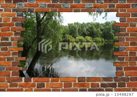 broken brick wall with view to the summer river 13498297