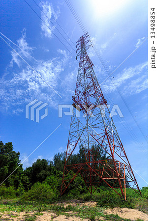 Power pylon with trees and blue sky and white clouds Power pylon with trees and blue sky and white clouds 13498854