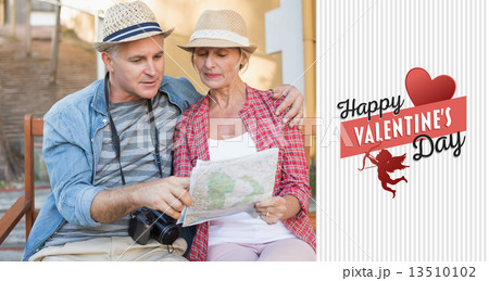 Composite image of happy tourist couple looking at map on a benc Composite image of happy tourist couple looking at map on a benc 13510102