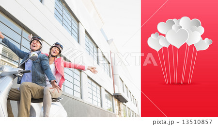 Composite image of happy senior couple riding a moped Composite image of happy senior couple riding a moped 13510857