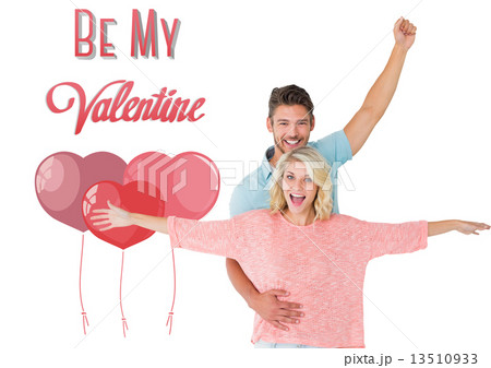 Composite image of attractive couple smiling and cheering Composite image of attractive couple smiling and cheering 13510933