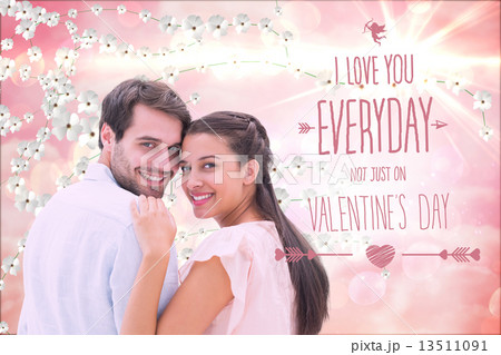 Composite image of attractive young couple smiling at camera 13511091