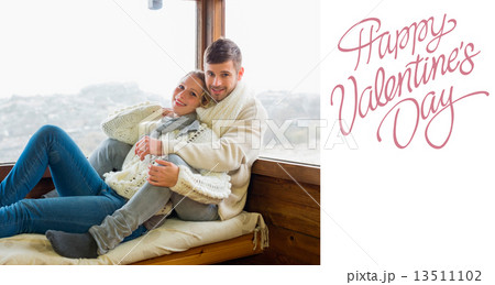 Composite image of couple in winter clothing sitting against cab Composite image of couple in winter clothing sitting against cab 13511102