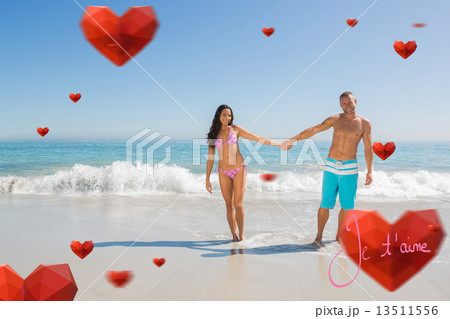 Composite image of smiling handsome man holding his girlfriends Composite image of smiling handsome man holding his girlfriends 13511556