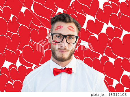 Composite image of geeky hipster with kisses on his face 13512108