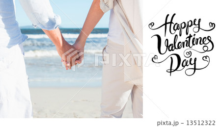 Composite image of couple on the beach looking out to sea holdin Composite image of couple on the beach looking out to sea holdin 13512322
