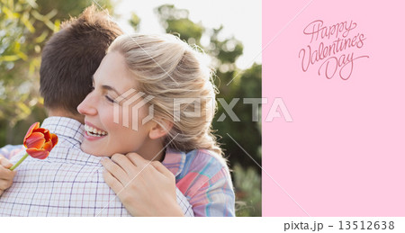 Composite image of smiling young couple embracing in park Composite image of smiling young couple embracing in park 13512638