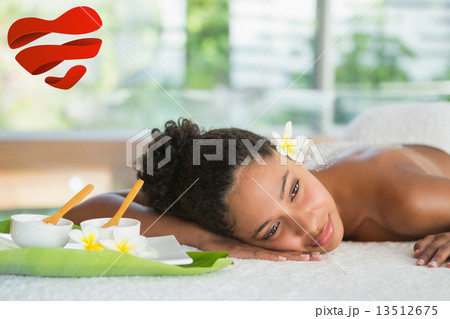 Composite image of gorgeous woman lying on massage table with sa 13512675