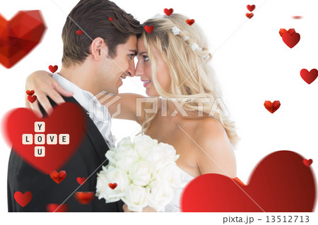 Composite image of beautiful young married couple looking each o Composite image of beautiful young married couple looking each o 13512713