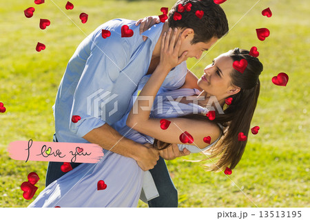Composite image of loving and happy couple dancing in park 13513195