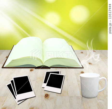 open book and instant photo with cup of coffee 13517444
