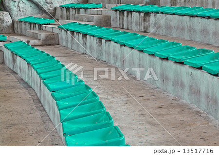 old plastic blue seats on stadium 13517716