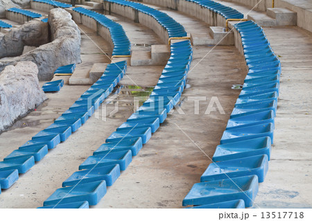 old plastic blue seats on stadium 13517718