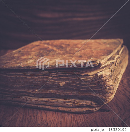 Vintage book on a wooden background 13520192