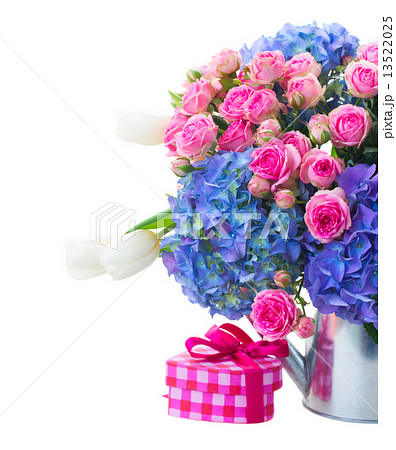 pink roses and blue hortensia flowers close up 13522025