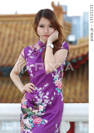 Pretty girl in purple cheongsam Pretty girl in purple cheongsam 13525233