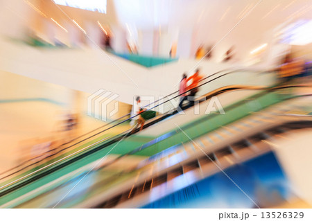 People in escalators at the modern shopping mall People in escalators at the modern shopping mall 13526329