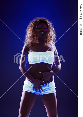 Image of excited girl posing in neon light 13526769