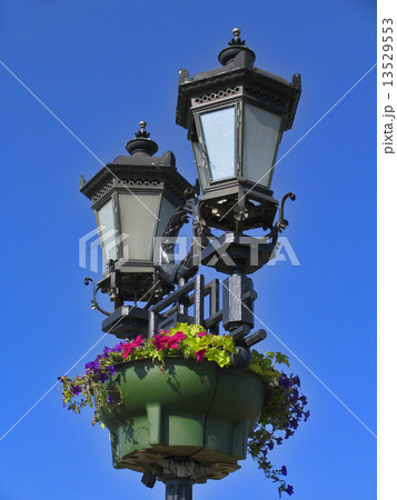 Vintage street lamps against bright blue sky Vintage street lamps against bright blue sky 13529553