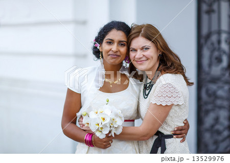 Beautiful happy indian bride and her girl friend Beautiful happy indian bride and her girl friend 13529976