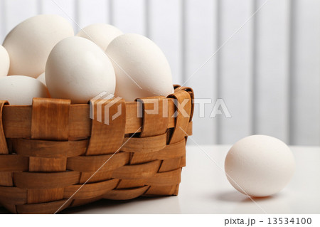 White eggs in a basket 13534100