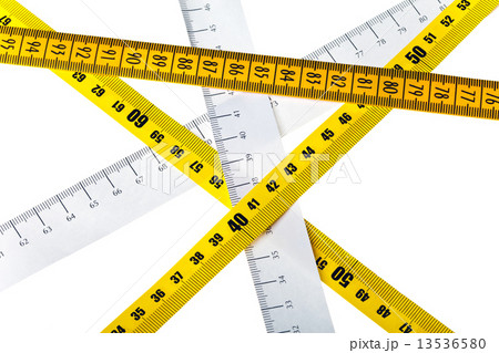 tape measures cross on white background 13536580