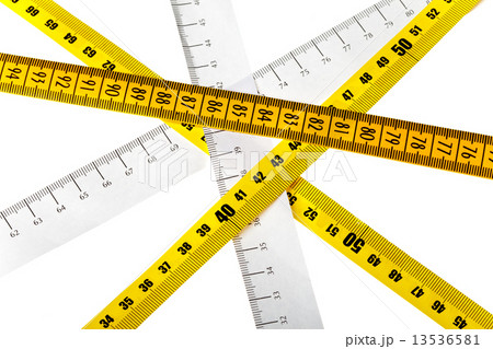 tape measures cross on white background 13536581